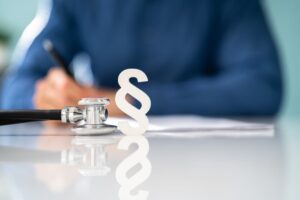 A gavel and stethoscope in court symbolize legal action in medical malpractice cases.