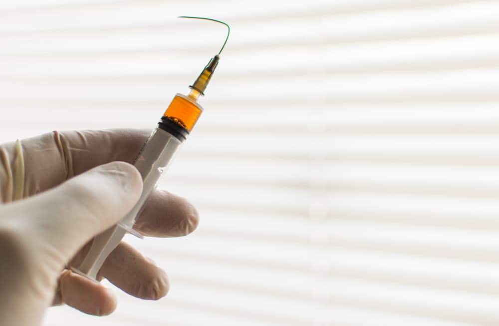 A syringe with a bent needle symbolizes anesthesia malpractice, highlighting the risks of medical negligence.